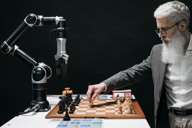 Human playing chess with a robot